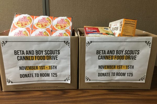 Boxes of donated pantry items ready to be delivered.